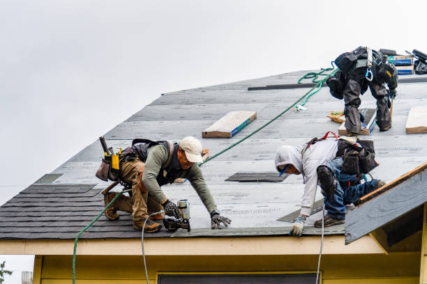 Professional Gutter Installation technician working in Lowell, MA